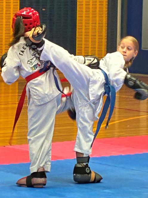 Cromwell Taekwon-Do champion Emerson Douglas, 10, winning the Gold Medal in sparring at the...