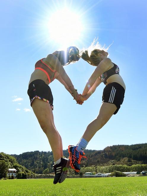 Otago Girls’ High school pupils, Sophie Wallis (16, left) and Tessa Buschl (15) soak up the sun at Logan Park this week. Photo: Stephen Jaquiery