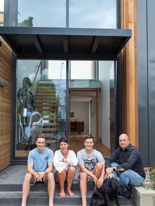 Barry and Jude Timmings with sons Alex (left) and Ben and their dog Bella. Photo: Sharron Bennett