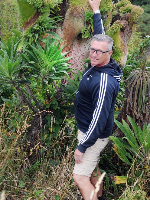 Paul Martin stands next to an Echium candicans (Pride of Madeira) with a rare fasciation near...