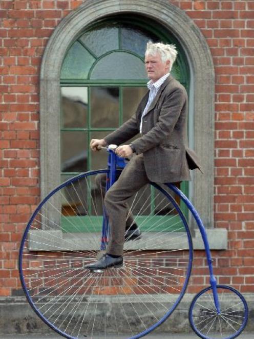 Riding in style ... Riding his home-built penny farthing during last year's Dunedin Tweed Ride...