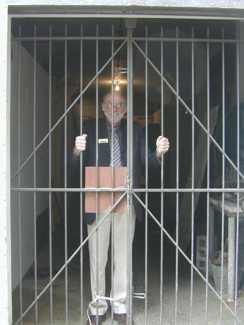 Real estate salesman John Kelly behind bars in one of the bunkers when some of the buildings were...