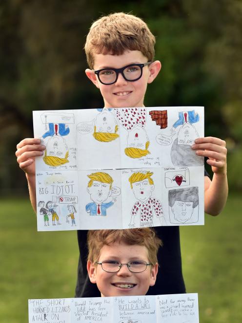 Macandrew Bay School pupils Sam McGee (top) and Dimitri Latton with their zines about Donald Trump. Photo by Peter McIntosh.