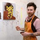 Craig Freeborn works on a portrait in his Dunedin studio. Photo by Linda Robertson.
