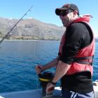 Environmental officer Nathan Manning uses a hydro-lab to measure the pH and oxygen levels of the...