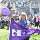Midwife Maureen Donnelly takes part in the  gathering she organised in the Octagon to support Otago midwives. Photos by Peter McIntosh.