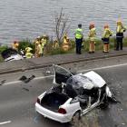 Emergency services assist injured motorists after a two-car crash in the Dunedin suburb of St Leonards yesterday. 