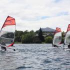 A group of young sailors get to grips with the Bic training boats during a sailing clinic on Lake...
