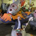 Dunedin Santa Parade Trust chairman Mark Laughton plays among the parade floats in Dunedin yesterday with toys made by Otago Corrections Facility prisoners. Photo by Gerard O'Brien.