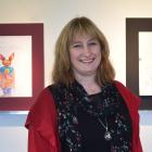 Sam Henderson with some of the Clive Barker works in the exhibition at Fe29 Gallery. Photos:...