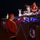 Debra Miles shows off some of her home-made Christmas lighting displays at her home in St...