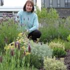 Lisa Burton in a herb plot at the living campus. Photos: Charmian Smith.