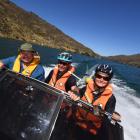 David Wright, from Roxburgh, gives long-distance cyclists Chris (centre) and Hamish (14) Kirkman, of Dunedin, a lift on the Lake Roxburgh rail trail gap yesterday. Photo by Stephen Jaquiery.