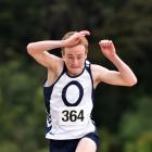 Jackson Toms (15), of Otago Boys' High School, leaps to a triple jump record at Saturday's Otago secondary school athletics championships at the Caledonian Ground in Dunedin. Photos by Peter McIntosh.