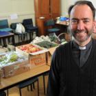 The Rev Michael Wallace relaxs after packing fruit and vegetables into bags for the All Saints’ fruit and veges co-operative scheme. Photos by Christine O'Connor.