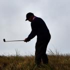 Peter Robson, of Brisbane, plays a chip shot on the ninth hole during the national left-handed...