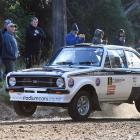Tony Gosling and Blair Read fly out of a dry ford at Whare Flat in their Ford Escort during the classic car section of Rally Otago. Photo by Stephen Jaquiery.