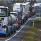 Traffic is delayed after a truck rolled near Milburn yesterday. PHOTOS: GREGOR RICHARDSON
