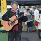 Mike Smith busks at the Dunedin Farmers Market. Photos: Craig Baxter