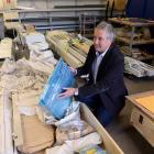 Otago Polytechnic principal engineering lecturer Stuart Allan opens crates containing a Vans RV12 kitset plane which will be built by students. Photo: Linda Robertson