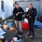 Clutha District Council building control manager Malcolm Sinclair and environmental health officer Trish Aitken assess the flood-damaged Wild Walnut Cafe in Lawrence. Photos: Samuel White