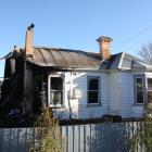 What remains of the house in Herbert on State Highway 1 after a fire tore through the building in...