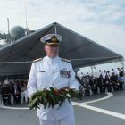 Commodore James Gilmore, representing New Zealand defence forces, prepares to lay a wreath in the...