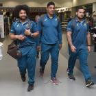 Wallabies forwards (from left) Tatafu Polota-Nau, Lopeti Timani and Tetera Faulkner walk through Dunedin Airport during a low-key welcome for the team last night. Photos: Gregor Richardson