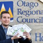 Otago Regional Council senior public transport operations officer Julian Phillips holds new bus timetables. Photos: Peter McIntosh