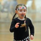 Neave Bisset (4) of Milton, strides out during her performance with Tokomairiro Early Learning Centre at 2017 Otago Polyfest yesterday. Photos: Christine O'Connor