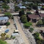 An image from a drone shows the extent of damage along Reservoir Creek, with tonnes of rocks lining the concrete culvert after Sunday’s flash flood. Photo: Craig Baxter