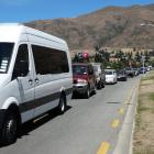 Traffic along Ardmore St beside Wanaka's lakefront was either gridlocked or could only crawl as the town struggled to cope with the influx of New Year revellers on the move. Photos: Kerrie Waterworth
