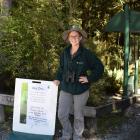 Ranger Sophie Briggs standing beside the Doc notice at the start of the Blue Pools Track alerting walkers there is a ranger on the walk today. Photos: Kerrie Waterworth