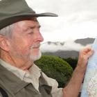 Mystery hunter Tony Healy with a map of where the New Zealand mysteries are in  the South Island....