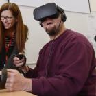 Animation Research chief executive Cheryl Adams shows an Otago Corrections Facility inmate the new virtual reality simulation, designed to teach automotive engineering skills. Photos: Gregor Richardson