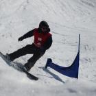Ross Whitelaw, of Wanaka, swoops round another gate during the banked slalom competition. Photos:...