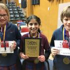 The winners of the year 5-6 Otago Daily Times Extra! current events quiz in Cromwell last night (from left), year 6 pupils Olivia Huddleston (11), Ania-Kanu Saklani (10) and Oscar Crowe (10), of Holy Family Catholic School, in Wanaka, celebrate their succ