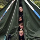 Huddling in their tent at Waiora Scout Camp are Brighton-based scouts (from top) Grace-Anne Patel...