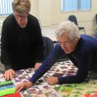 Isabell Page (left) and Joan Henderson, of Netherby WI, plan the design of one of the five bed quilts being made for St John’s sleeping quarters in Ashburton. Photos: Toni Williams