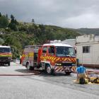 Emergency services at the scene of the fire at the local branch of LJ Hooker in Roxburgh. Photo: Simon Henderson