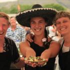 Williburto's staff William Nehoff, left, Barbora Grygarova, and Isabell Muehlenbeyer serve up Mexican fare at the Kurow Festival Market day yesterday. Photos: Hamish Maclean.