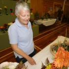 Jane Pheasant, of Dunedin, admires the floral arrangements. Photos: Alexia Johnston