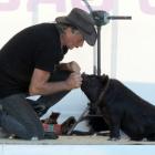Handler Billy Black Woolman tries to persuade Jonah the 6-month-old kunekune to wave goodbye to...