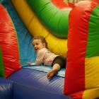 Stella Brown (4), of Brighton, plays on an inflatable slide.

