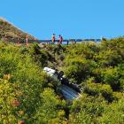 A truck came to a crashing halt on the cliff edge of the Crown Range Rd between Queenstown and...