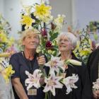 Admiring a lily at the Otago Lily Society show at Forbury Park Raceway on Saturday are (from left...