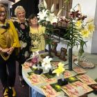 Admiring the top award winners at the Otago Lily Society show on Saturday are (from left) Jo...