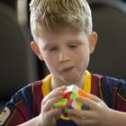 Racing to solve a Rubik’s Cube at Forbury Park at the weekend are Nate Vincent (10),