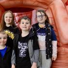 Exploring a giant inflatable brain are (clockwise from left) Xavier Roach (4), Abbie Roach (8),...