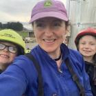Clinton dairy farmer Madeline Anderson and her two children Beau(7) and Florence (8) take a break...